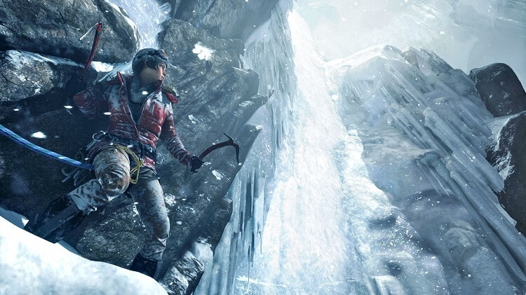 Lara prepares to scale an icy cliff in Rise of the Tomb Raider.