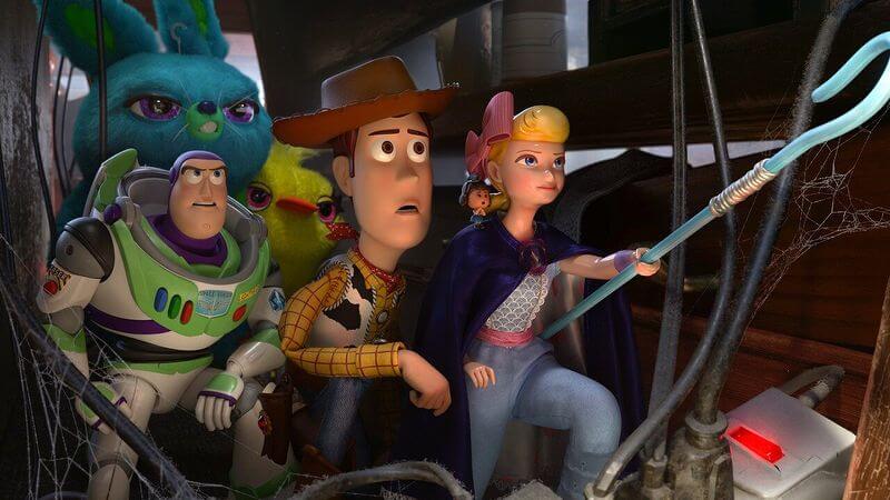 woody, buzz and company sneak around in Toy Story 4