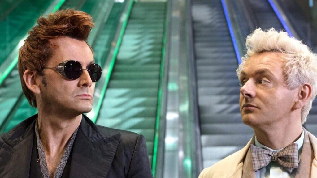 Crowley and Aziraphale looking at each other on an escalator Good Omens
