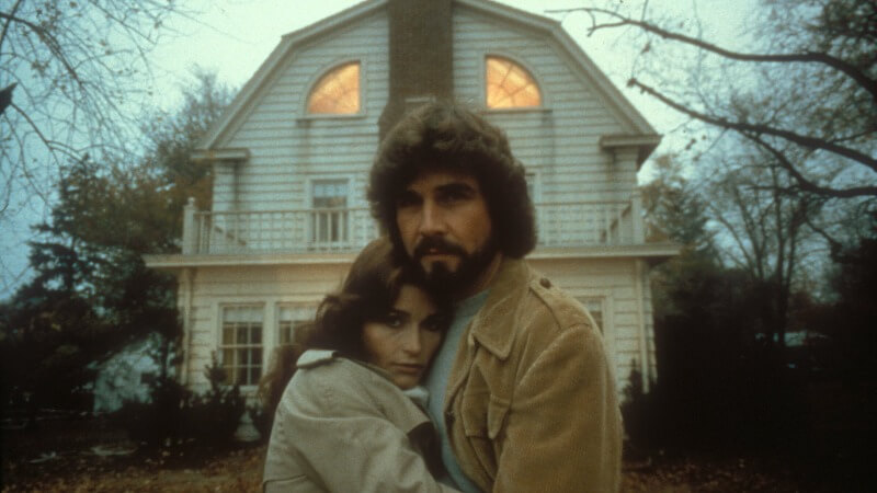 The Lutz family in front of the Amityville house