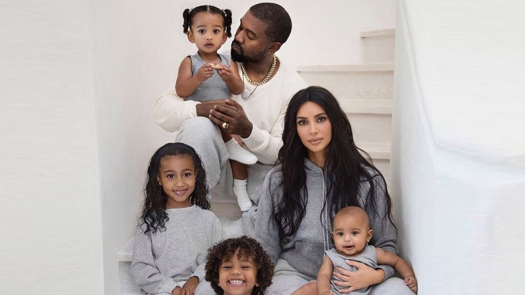 Kanye West and his ex-wife Kim Kardashian posing with their kids