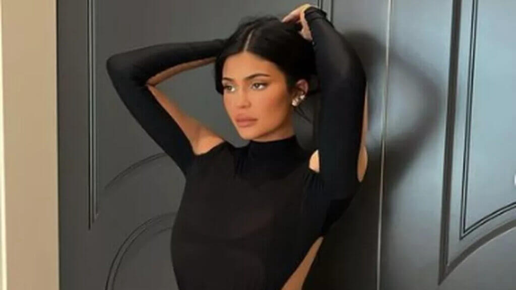 Kylie Jenner poses in a black outfit