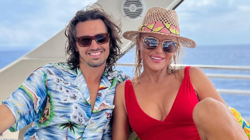 Diana Jenkins and her fiancé Asher Monroe pose in a waterfront