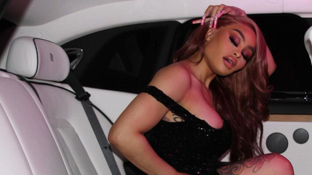 Blac Chyna rocks side-swept hair while riding in a car