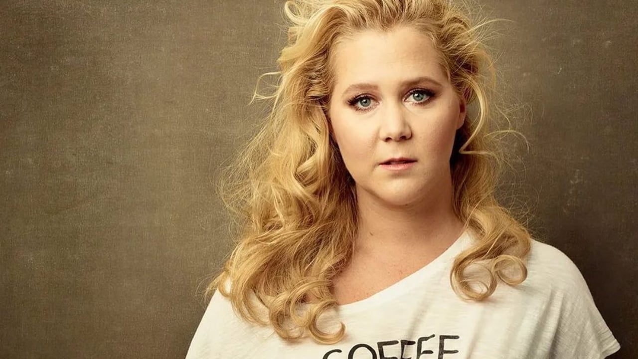 Amy Schumer rocks white top with her hair down