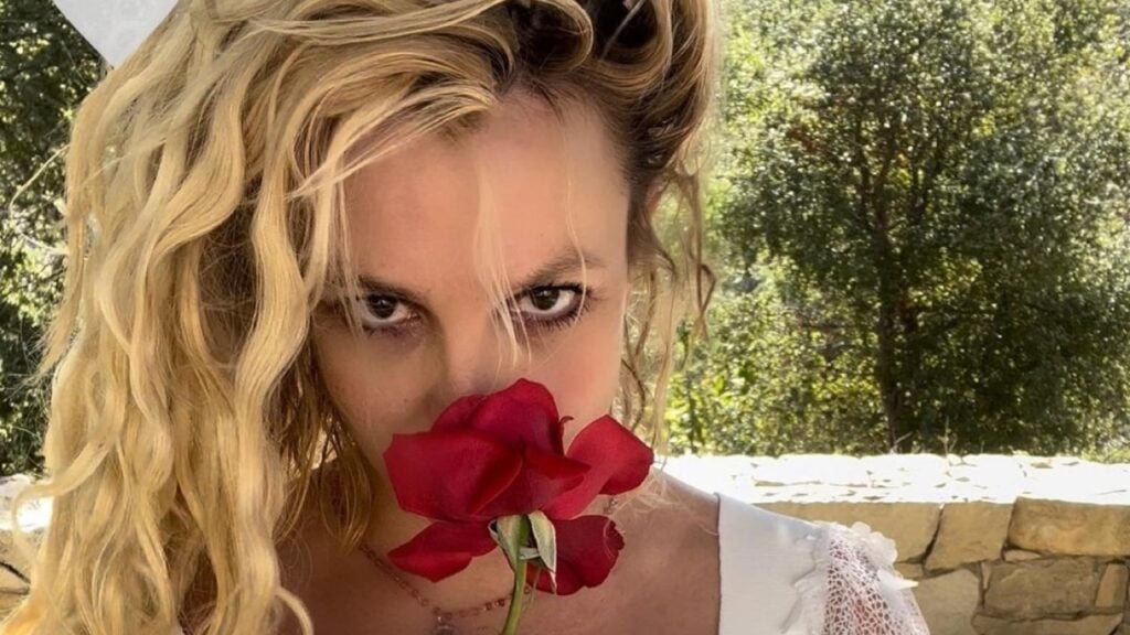 Britney Spears sniffs a red rose in personal photo