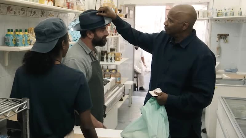 Denzel Washington gives his hat to a fishmonger in The Equalizer 3