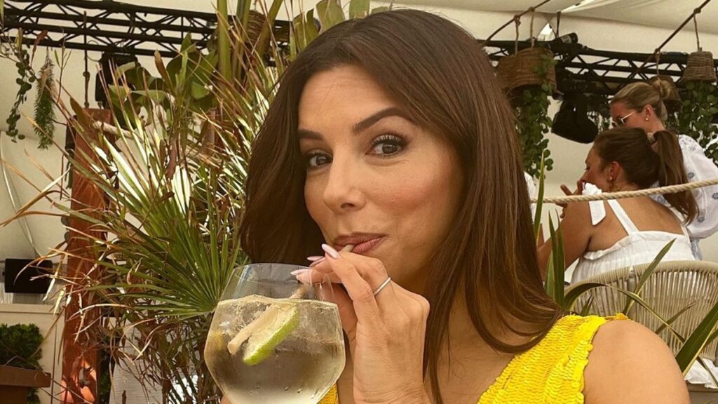 Eva Longoria sips a drink on summer outing