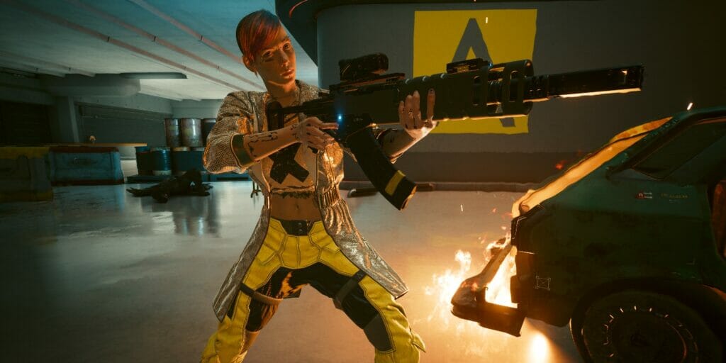 V stands beside a fire, aiming her rifle in Cyberpunk 2077
