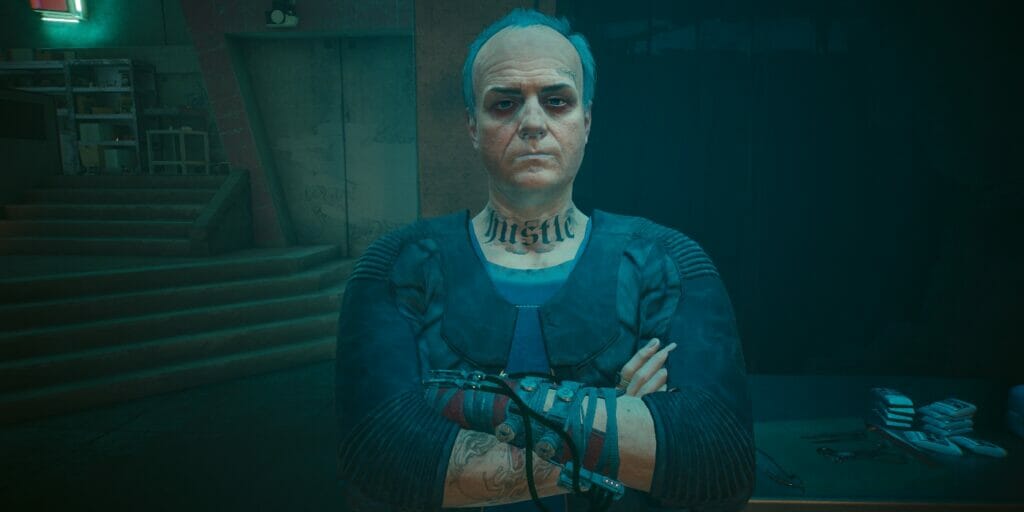 A ripperdoc stands in his clinic in Cyberpunk 2077