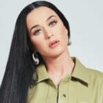 Katy Perry poses indoor in green shirt