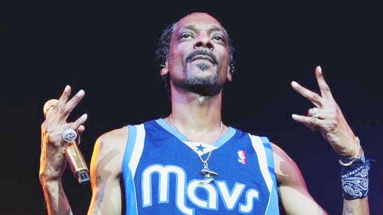 Snoop Dogg holding a mic