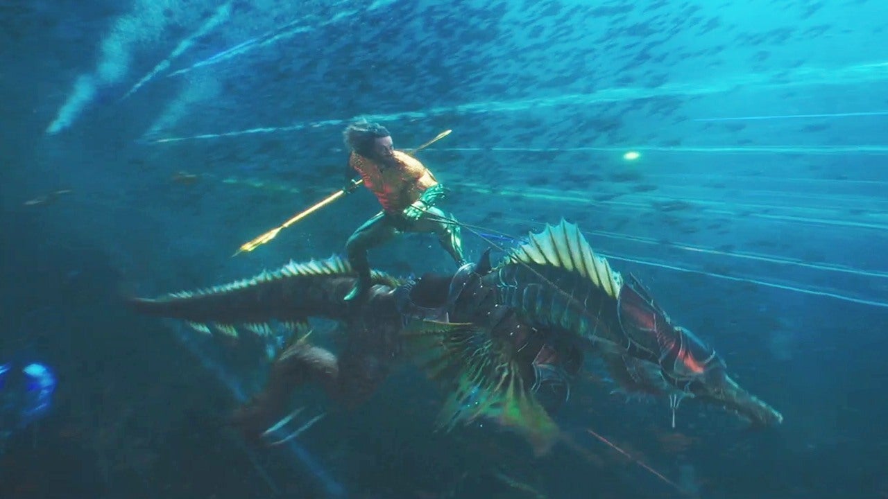 A shot of Aquaman riding a sea-dragon