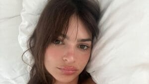Emily Ratajkowski posing nude in bed