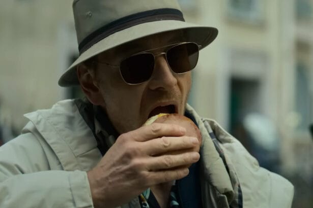 Michael Fassbender eating a burger in David Fincher's The Killer.