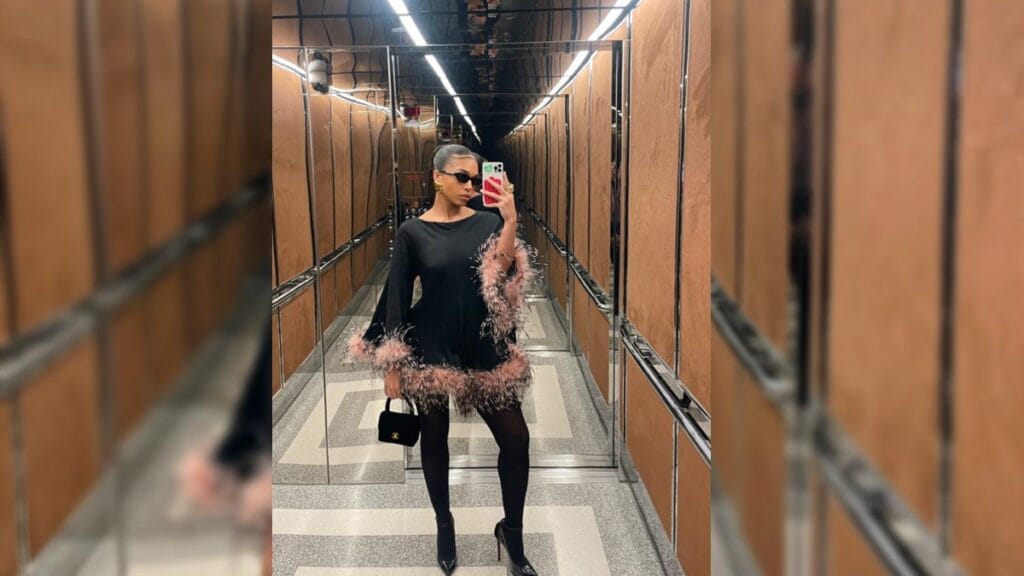 Instagram photo of Lori Harvey posing in a mirrored elevator