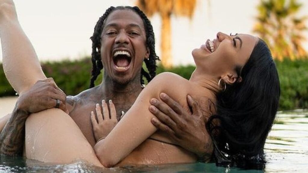 Bre Tiesi and Nick Cannon in a pool