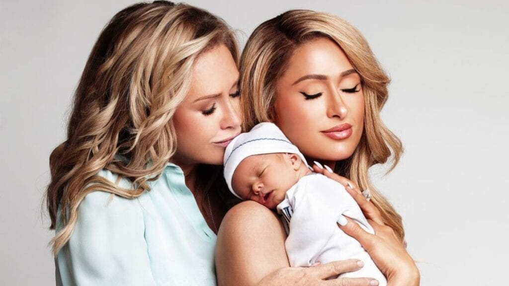 Paris Hilton posing with her mom Kathy and new baby Phoenix