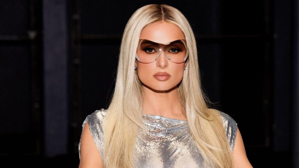 Paris Hilton in silver costume and glasses