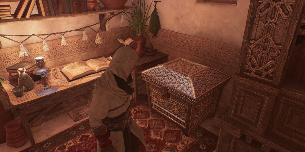 The chest with the Hidden Ones outfit is downstairs in Al-Jahiz's house.