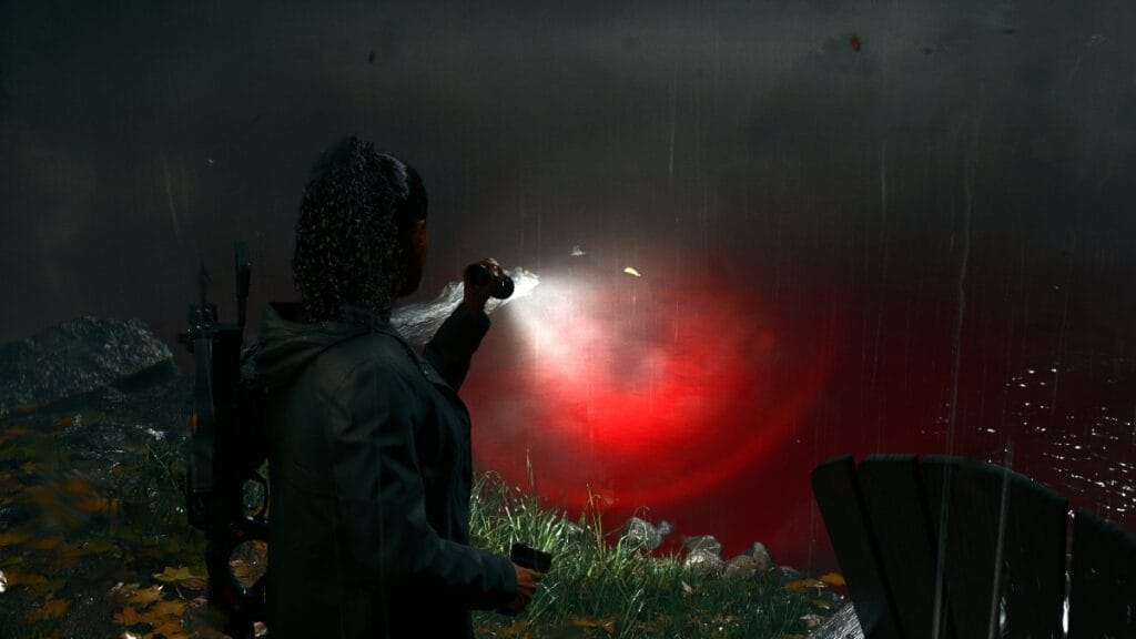 Saga looks at a lake of blood in Alan Wake 2