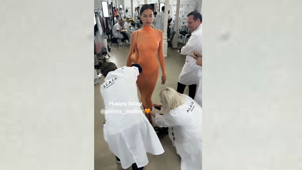 Irina Shayk in a sheer orange dress