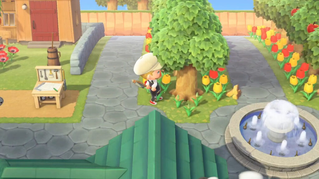 The player chops a tree for wood to make Log Stakes in Animal Crossing New Horizons