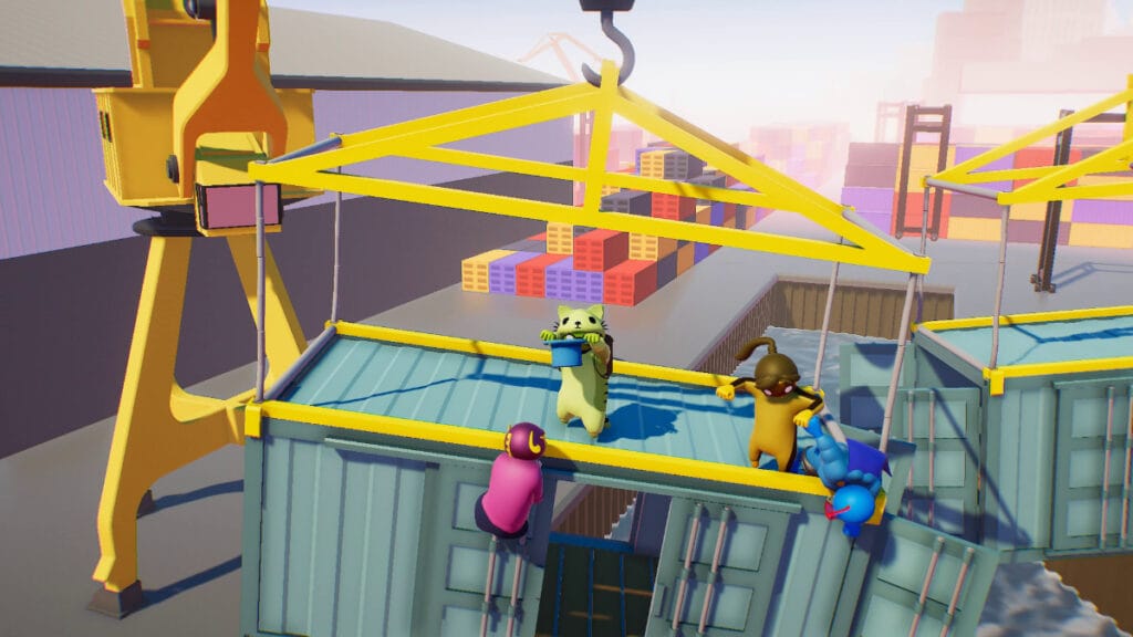 Costumed characters battle atop a shipping crate in Gang Beasts