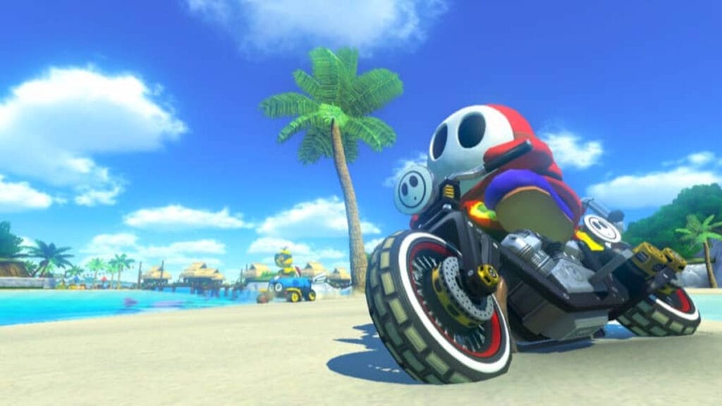 Shy Guy races down the beach in Mario Kart 8 Deluxe, one of the most fun games you can play on Christmas
