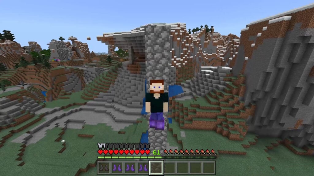 A player falls off a high place in Mojang's sandbox game