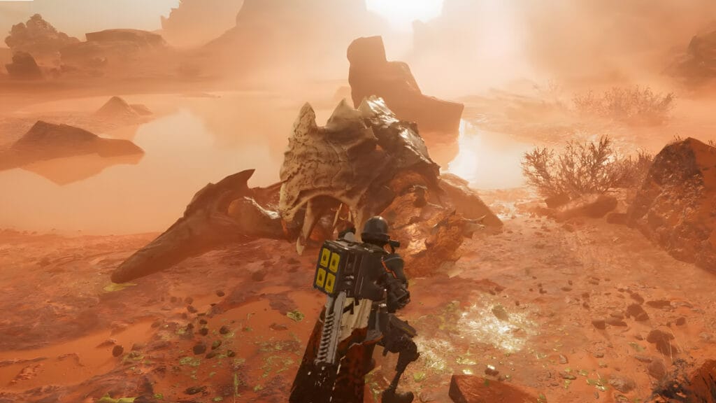 The player stands in front of a dead Charger in Helldivers 2