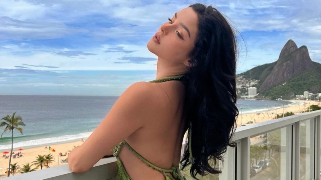 Demi Rose stares out the beach from balcony in Brazil