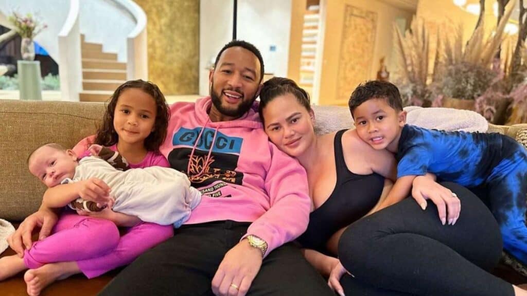 Chrissy Teigen and John Legend pose for a family photo with their kids.