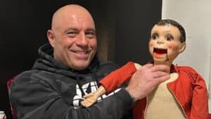 The Joe Rogan Experience host Joe Rogan holding a puppet.