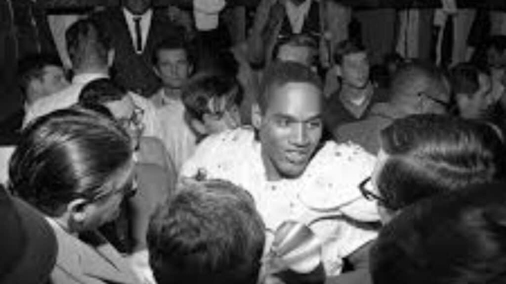 O.J. Simpson surrounded by fans