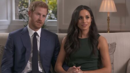 Prince Harry and Meghan Markle sitting on a couch during an interview with BBC News.