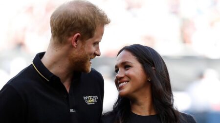 Prince Harry and Meghan Markle at a baseball game.
