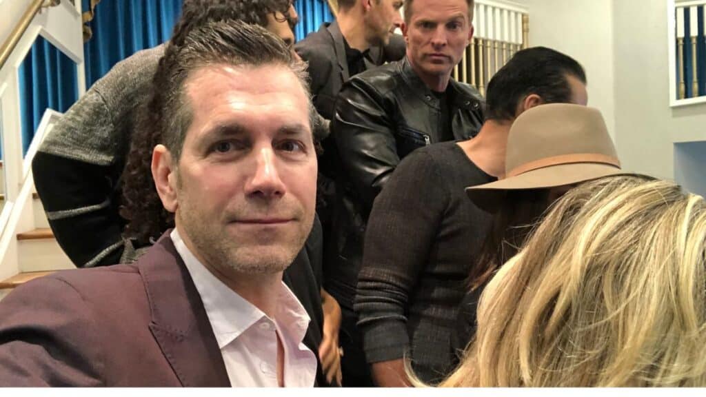 General Hospital executive producer Frank Valentini poses for a photo with Steve Burton and the rest of the cast.