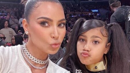 Kim Kardashian poses for a photo with her daughter North West.