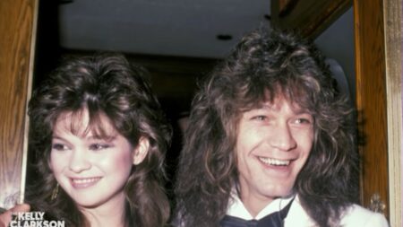 Valerie Bertinelli and Eddie Van Halen smiling while posing for a photo.