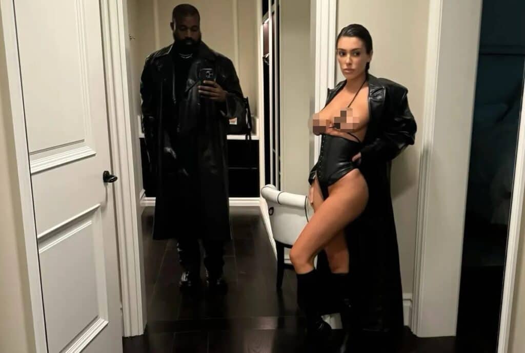 Kanye West and his wife Bianca Censori pose at home.