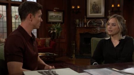 The Bold and the Beautiful characters Finn and Hope have a discussion in the Forrester Creations office.
