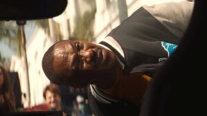 Eddie Murphy as Axel Foley being arrested in Beverly Hills Cop: Axel F, which may or may not have a post-credits scene.