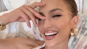 Jennifer Lopez smiles in bed